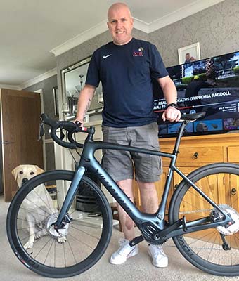 Irwin Mitchell client Ian with his electric bike